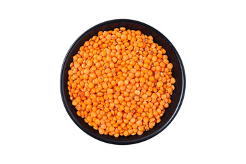 Red split lentil in black bowl isolated on white background