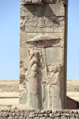 Bas-relief with king walking under an umbrella, Persepolis, Iran