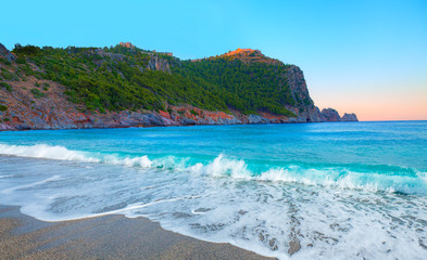 Beach of Cleopatra with sea and rocks of Alanya peninsula - Antalya, Turkey