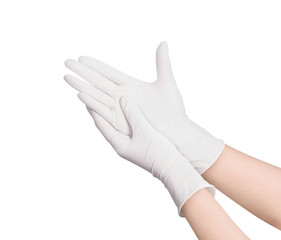 Two white surgical medical gloves isolated on white background with hands. Rubber glove manufacturing, human hand is wearing a latex glove. Doctor or nurse putting on nitrile protective gloves