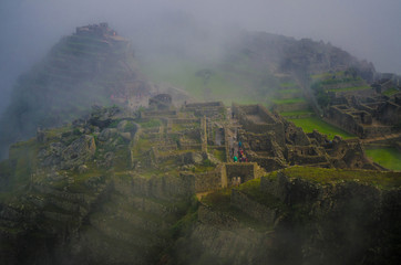 Fototapeta premium Machu Picchu, located halfway between the Andes and the Amazon rainforest, was colonized by mountain populations, a UNESCO World Heritage Site. One of the seven wonders of the world