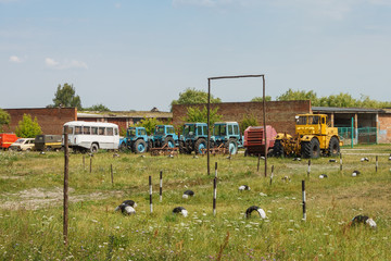 Stara Vyzhivka, Ukraine - June 20th, 2019: Garages and parking of agricultural machinery