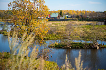 Autumn landscape, view of the river and village, nature of the middle Urals, Siberia
