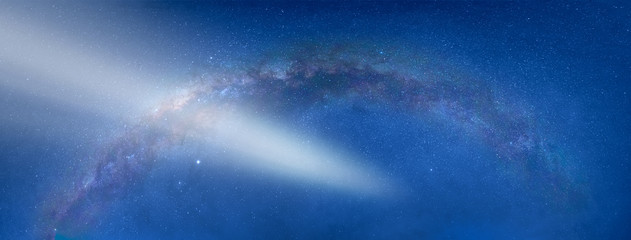 The milky way galaxy in the night sky on the background comet
