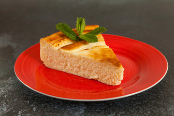 portion delicious cheesecake with mint leaf