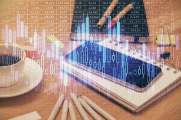 Double exposure of forex chart drawing and cell phone background. Concept of financial trading