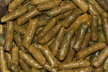 Turkish traditional cuisine, stuffed grape leaves. Turkish Sarma. Stuffed rice with green grape leaves.