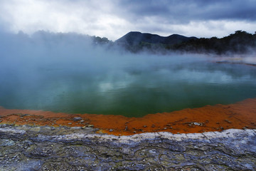 Geothermal lake with an orange shoreline