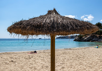 beach umbrellas on Palmanova beach in Calvia Bol ses Taules Mallorca, spain