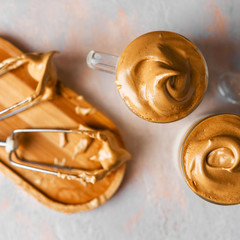 Dalgona Coffee two small cups and whisk,top view ,Korean trend home made coffee