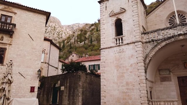 Cathedral of Saint Tryphon Square in old town of Kotor in handheld motion shot. The oldest Cathedral in Montonegro (Yugoslavia)