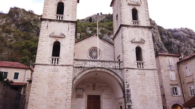 Tilt upwards shot of Cathedral of Saint Tryphon in Kotor, Montenegro with empty streets because of virus lockdown.