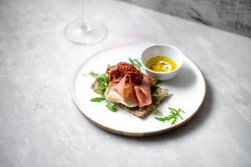 iberico ham sandwich on marble background with copy space