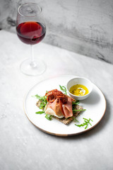 iberico ham sandwich on marble background with copy space