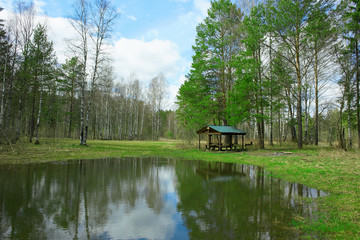 Fototapeta na wymiar Camping near small lake in the spring forest