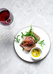 iberico ham sandwich on marble background with copy space
