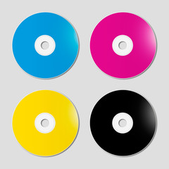 CMYK CD - DVD set on grey background