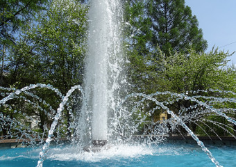 City fountain. Water column and fountain jets on a Sunny day