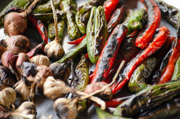 Fototapeta premium Green red chilies, onions, garlic and burn to prepare chili paste. Natural food ingredients.