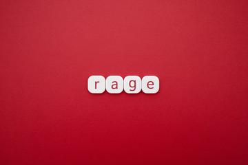 Alphabet rage word block with red background.