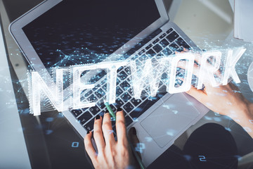 Double exposure of woman hands working on computer and data theme hologram drawing. Top View. Technology concept.