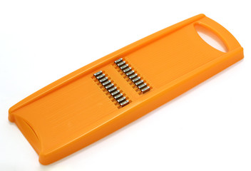 Orange grater for plastic carrots. Kitchen equipment for slicing carrots for korean salads or pickles