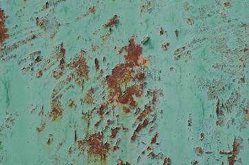 Old peeling paint. Rusty surface. Metal fence. Rust structure.