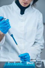 Fototapeta premium Placebo Controlled Study - Laboratory Technician Preparing Control Treatments for a Placebo Controlled Study