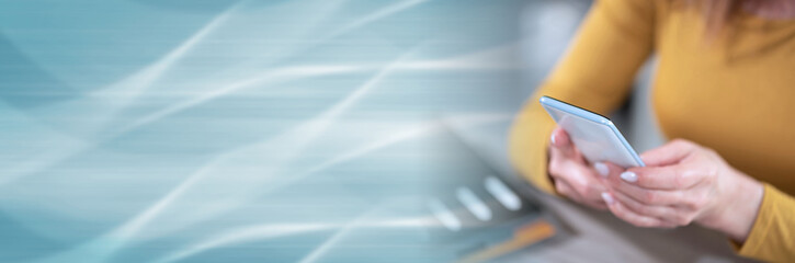 Woman using her mobile phone; panoramic banner