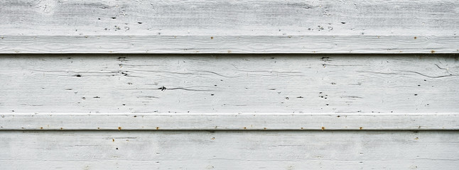 Old wood board painted white. Banner background