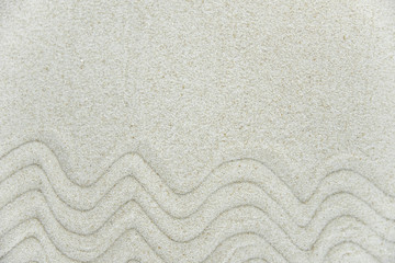 Abstract Zen drawing on white sand. Concept of harmony, balance and meditation, spa, massage, relax. Zen garden.