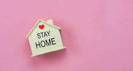 Table top view aerial image of STAY AT HOME work background concept quarantine of coronavirus,covid-19. Flat lay of home toy wooden with word and red heart.Healthcare & medical,work from home.