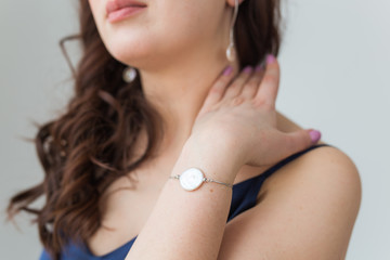 Close-up of beautiful woman wearing bracelet. Accessories, jewelry and bijouterie concept.