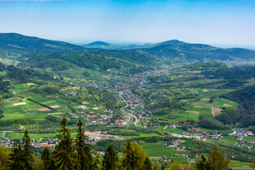 The village is located in the valley by the river. Spring Beskids landscape. Island Beskids, Poand.