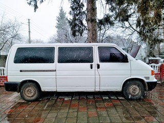 Car and farm yard in rural countryside at winter