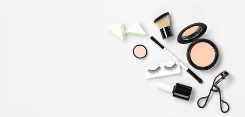 Beauty cosmetics makeup product flying. Woman make up, brushes lipstick falling in air. Creative fashion concept on white. Cosmetology make-up design color set fly, levitation.