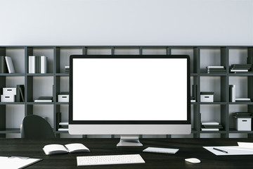 Minimalistic workplace desktop with white computer screen