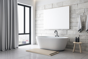 Modern bathroom with blank poster on wall