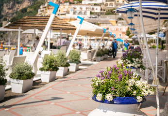 Fresh colourful flowers line the promenade on the sunny Positano coast Italy, Amalfi.