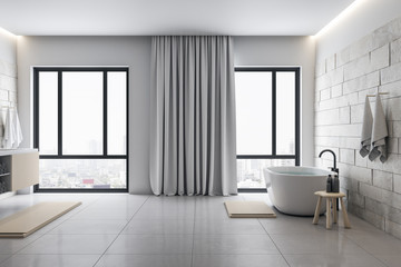 Luxury bathroom with decorative objects and panoramic city viwe.