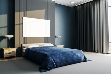 Bedroom interior with blue cover and empty poster on wall.