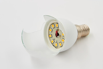Broken led lamp on a white background