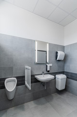 Fototapeta na wymiar Clean toilet in public restroom office building