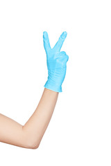 Hand in a disposable medical blue latex glove isolated on white.