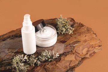 The concept of natural and natural cosmetics for personal care. Cream on a tree bark. Top view,...