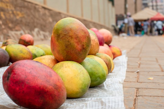 Mango for selling on a pavement in Kampala, Uganda.