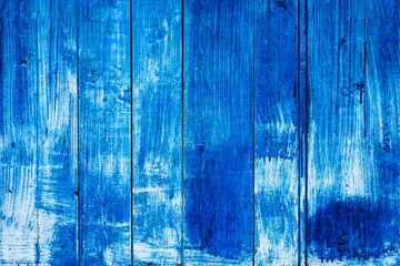 Fototapeta na wymiar A blue and white old painted vertical wooden planks texture