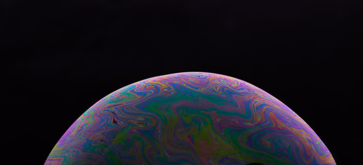 Soap bubble isolated on black