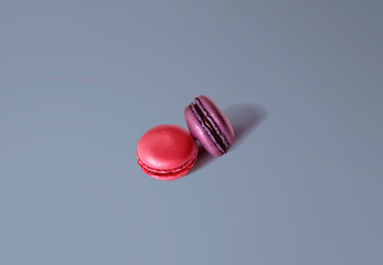 pink and purple macaroons blue background