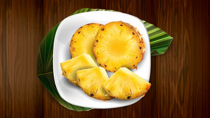 Composition of pineapple on a white plate and leaf.